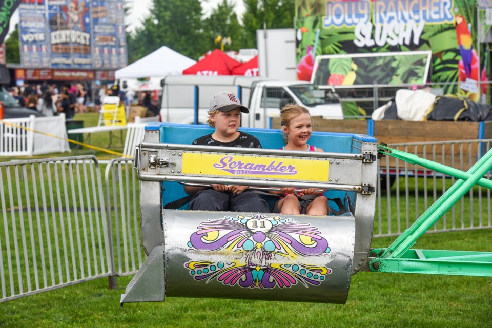 Joshua and Hannah enjoy the Scrambler - one of the many carnival rides at the Georgetown Ribfest.