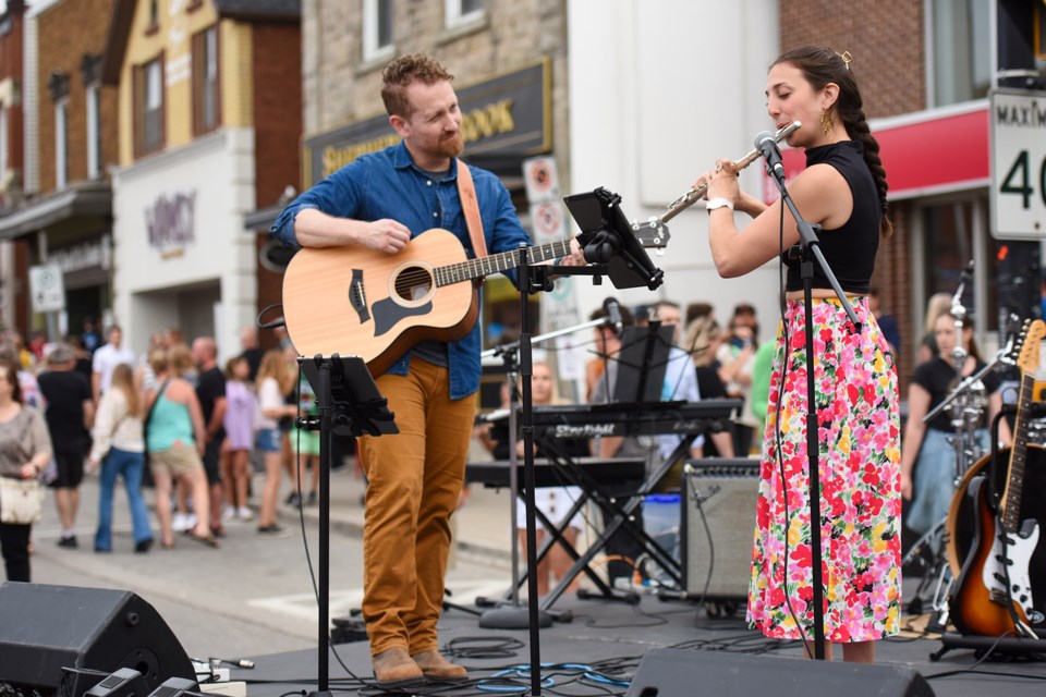 Madison Deppe and Patrick from duo Petrichor perform during the first Downtown Palooza.