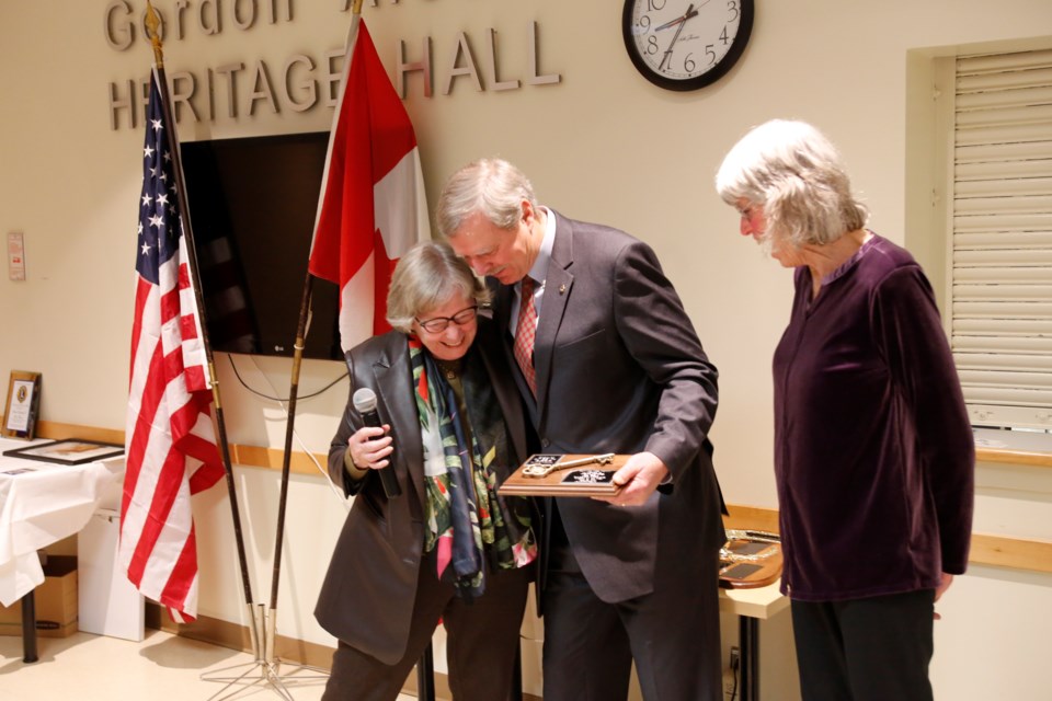 Ken Thorn hugs Mayor Ann Lawlor as she awards him and wife Susan Tupling with the key to the Town.