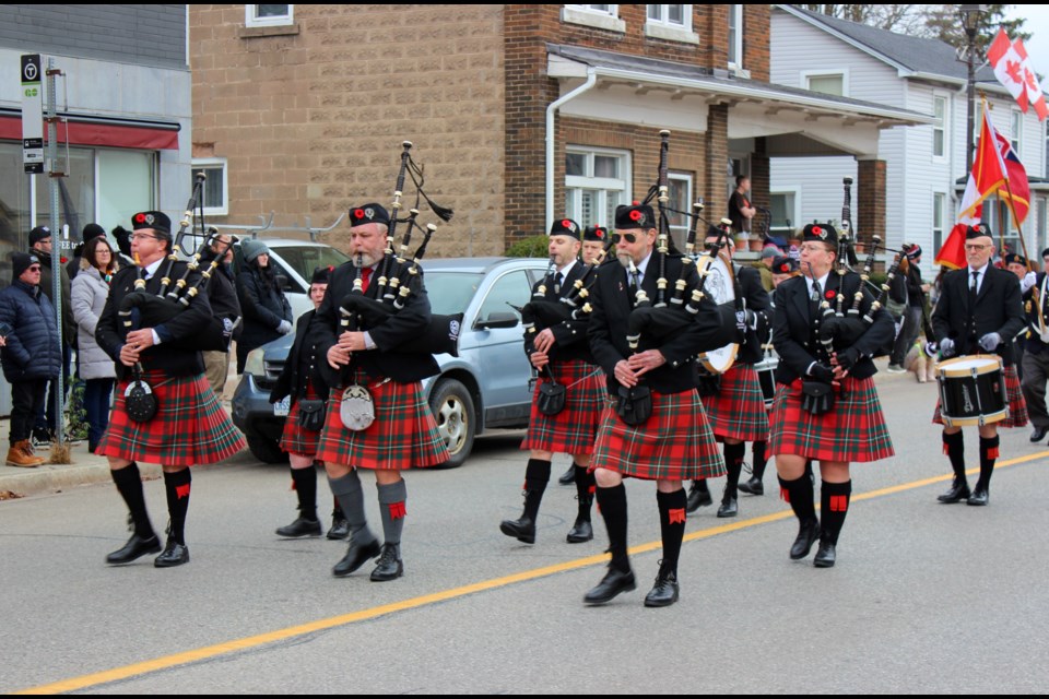 Bagpipers lead the parade through downtown Acton.