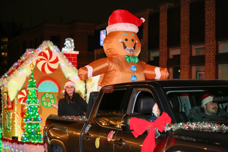 The Georgetown Lions Santa Claus Parade drew thousands of spectators Saturday night who enjoyed the festive spectacle as it toured by.
