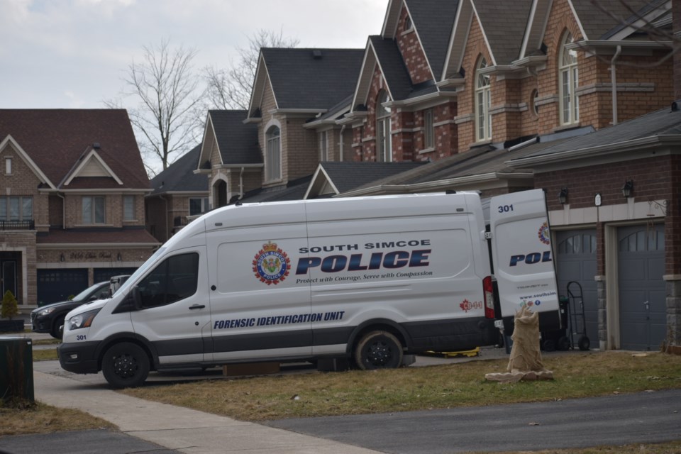 A South Simcoe Police Service forensic identification unit van on Hunter Street in Innisfil March 5.