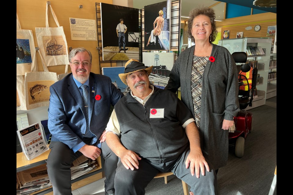 Innisfil Deputy Mayor-Elect Kenneth Fowler (left), artist and Canada Council for the Arts member Ron Haist and his wife, Marie, at the Innisfil Autumn Art Show & Sale. 