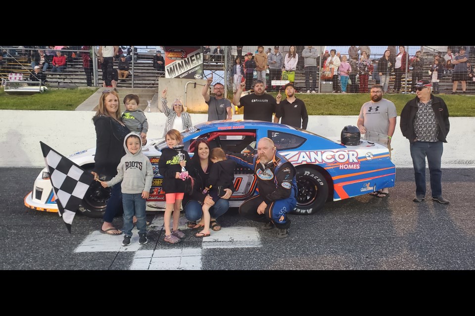 Dwayne Baker and family celebrate a win in the G.D. Coates Late Model Division