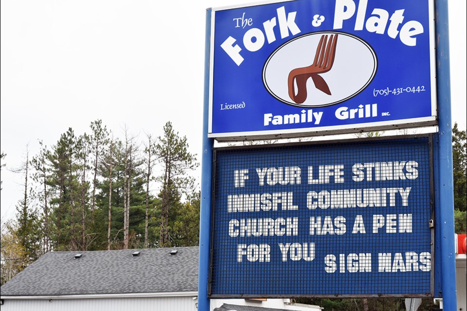 Fork and Plate family grill was quick to respond to the challenge issued by Innisfil Community Church, with a sign of its own. 