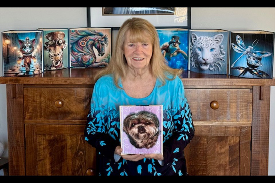 Sandycove Acres resident Marilyn Sehn uses art, technology, and elbow grease to 'upcycle' books by book folding, which makes them pleasing to the eye. She is pictured holding the finished product, which features a picture of her sister's dog, Molly.
