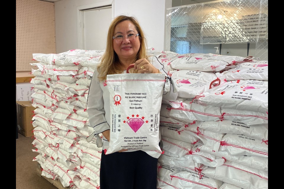 Mila Truong donates 100 bags of rice to the Innisfil Food Bank. Natasha Philpott/InnisfilToday