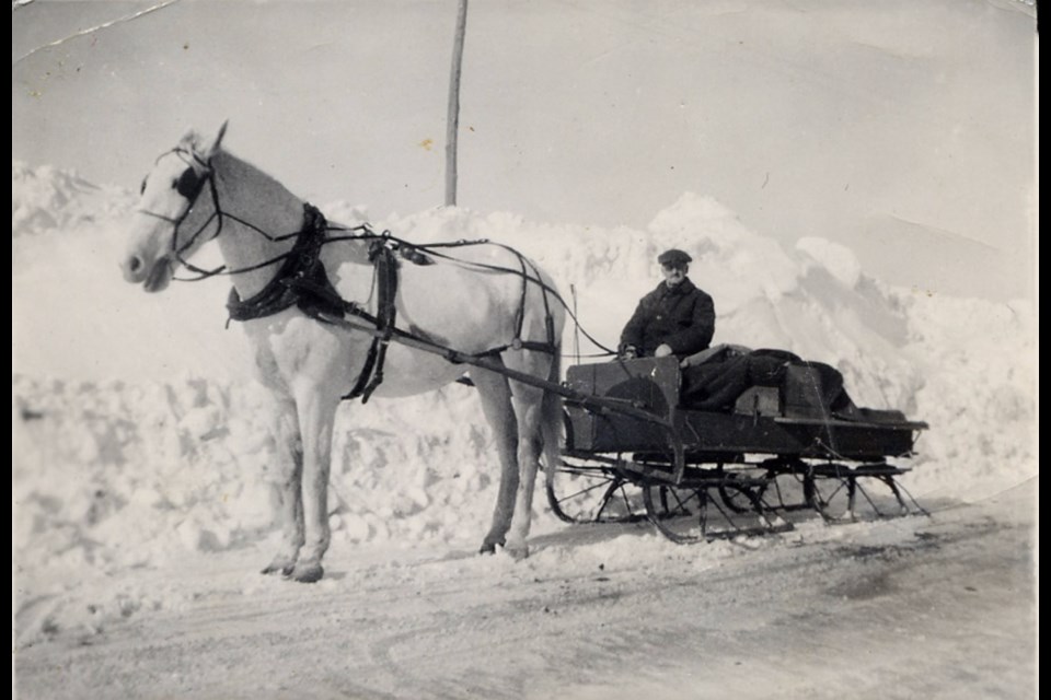 In the winter, Howard Cooper made deliveries by sleigh, wrapping the milk in blankets and furs to keep it from freezing.