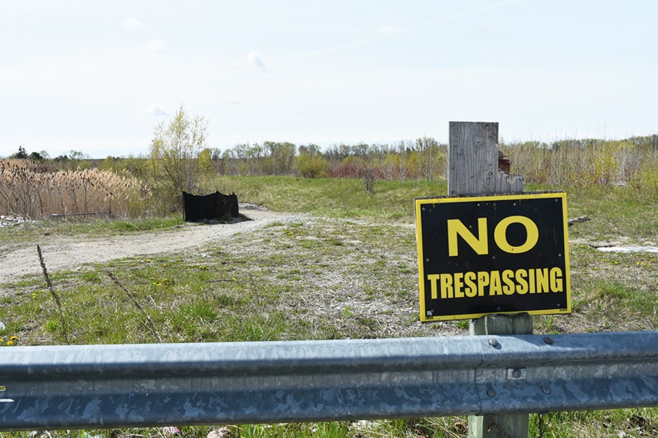No Trespassing sign posted on vacant property across from Nantyr Shores Secondary School.