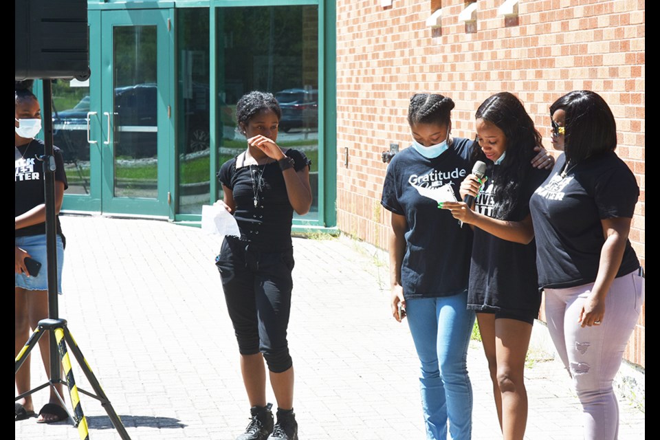 A student at Bradford District High School shares the impact of a racist video during an emotional moment at Saturday's rally at the Simcoe County District School Board office. Miriam King/Innisfil Today