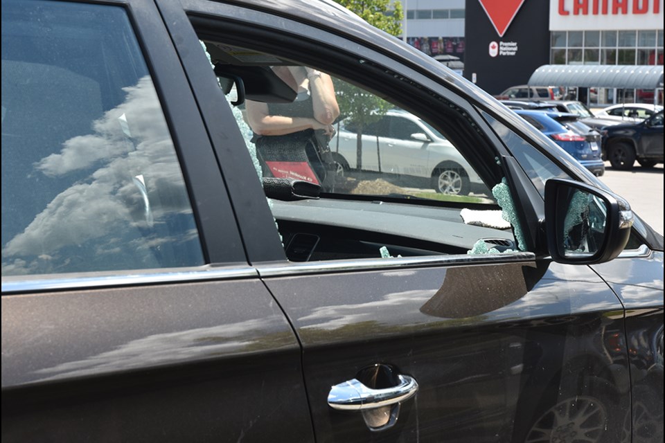 Police smashed the passenger side window of a Kia to rescue an infant left in a  hot car.  Miriam King/InnisfilToday
