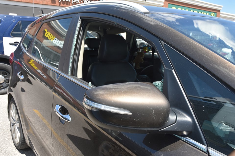 The passenger-side window of a vehicle was smashed to rescue an infant left in a hot car, Friday. Miriam King/InnisfilToday