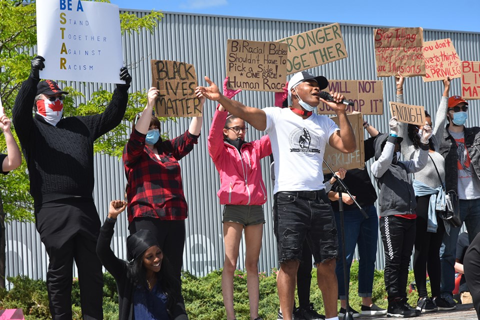 Errol Lee calls protesters up on stage to share their important messages, at June 13 rally at the Innisfil Recreation Complex. Miriam King/Innisfil Today