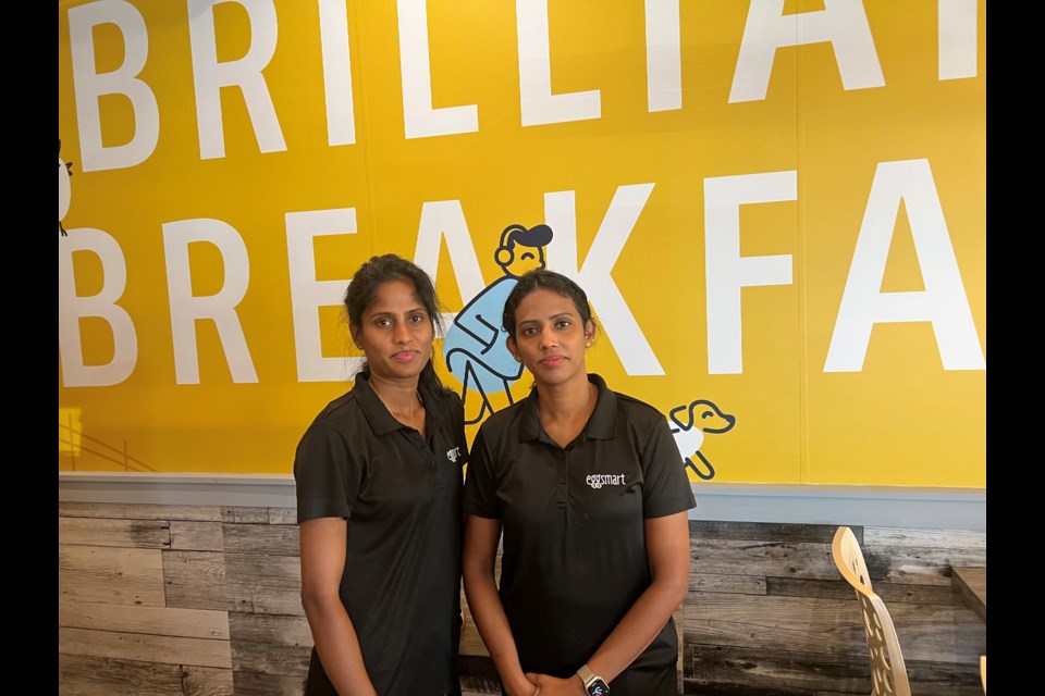 Co-franchisees and sisters, Viji Rasanathan (left) and Suba Rasanathan (right) on the day of the fundraiser for the families of Constables Morgan Russell and Devon Northrup. (Not pictured: co-franchisee, Jevan Bala) 