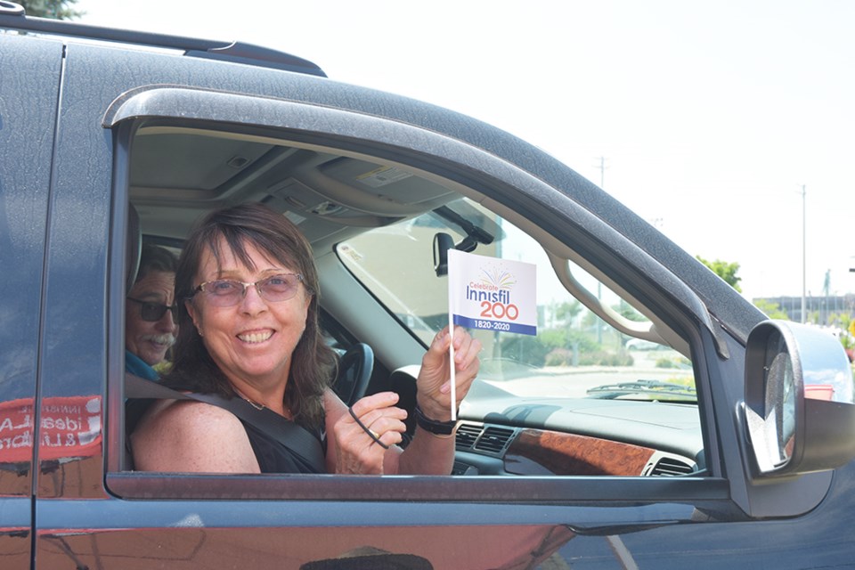 Cathy and Cameron McClure were first in line to pick up their copy of the 2020 Historical Review, Town of Innisfil 200th Anniversary Edition. Miriam King/Innisfil Today