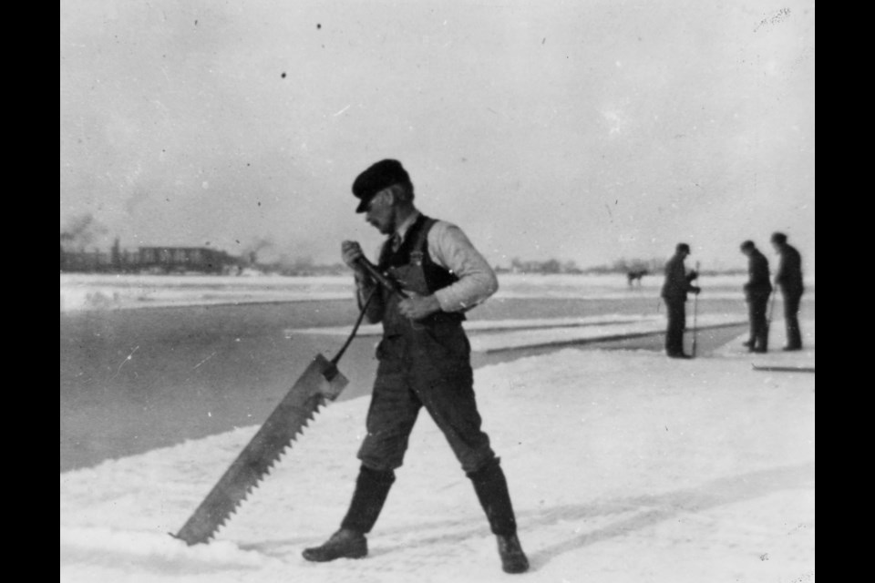 Ice was cut into large blocks with an ice saw, as wielded here by Frank Rogerson.