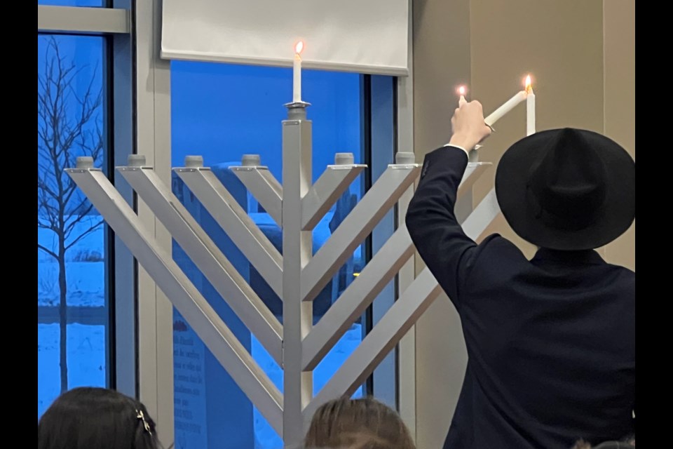 Rabbi Zevi Kaplan lit the menorah on the second night of Hannukah at the Innisfil Town Hall on Monday.