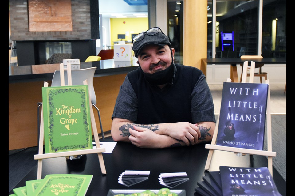 Author Raimo Strangis with his books, at the Innisfil ideaLAB's Lakeshore Branch.