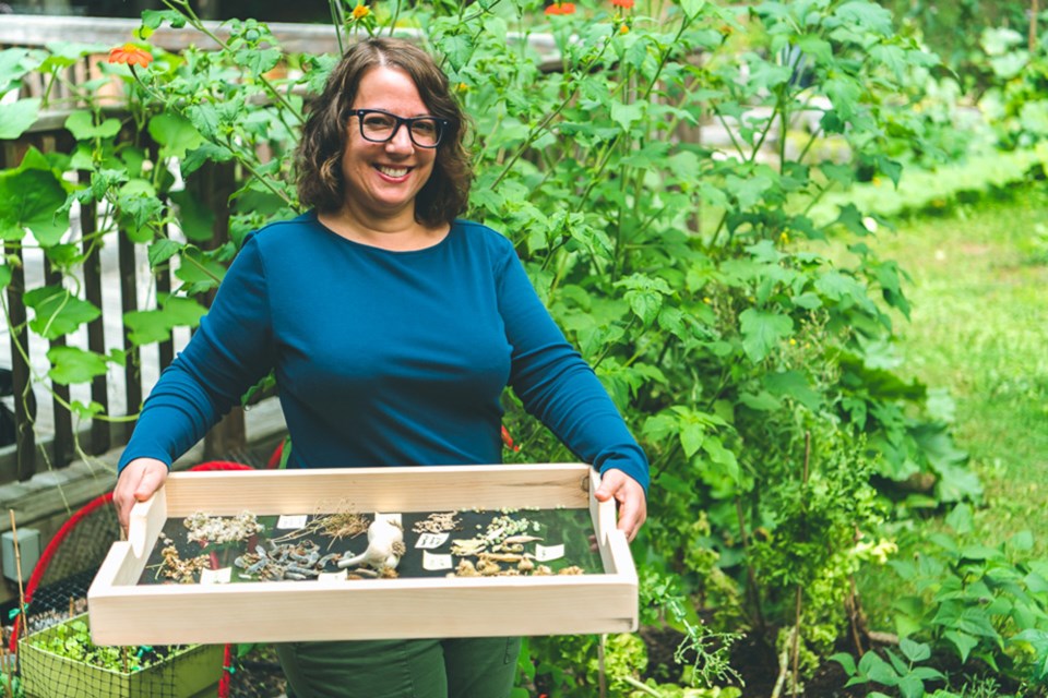 Bridget Indelicato, with a tray full of harvested seeds. Andrew Silk/Submitted photo