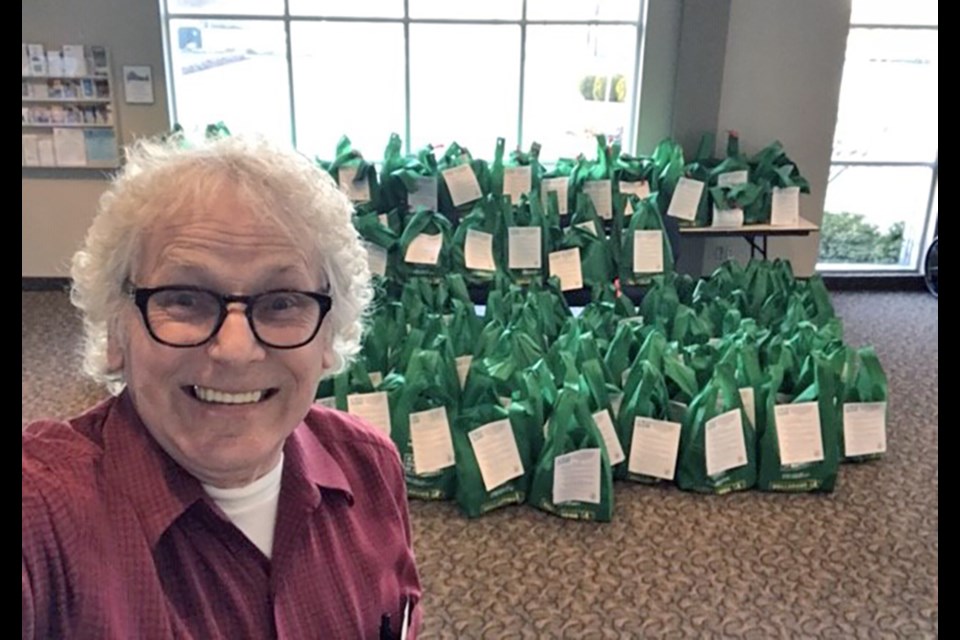 Pastor Howard Courtney with some of the 200 COVID-19 Kits prepared at the Innisfil Community Church. Submitted