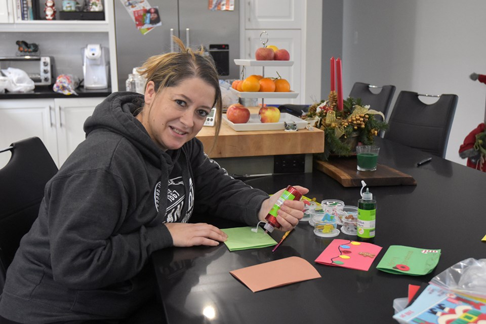 Sonia DaSilva works on home-made Christmas cards, to bring cheer this holiday season. Miriam King for InnisfilToday