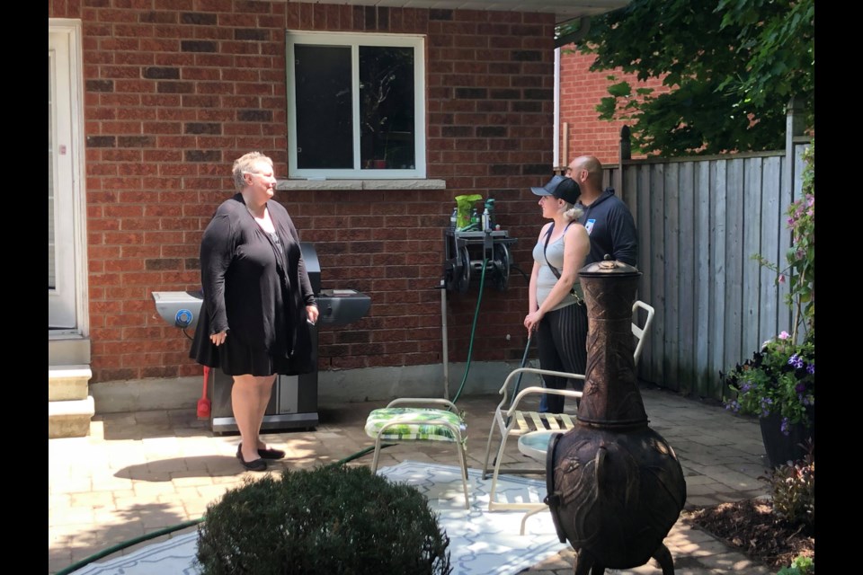 Innisfil mother and cancer patient, Paula Chamberlain gets a glimpse of her new garden. Submitted.
