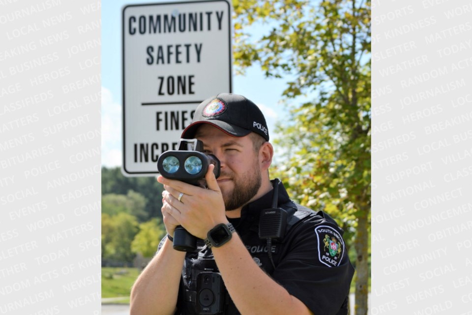 South Simcoe police Const. Mathew Winch does speed enforcement in a community safety zone. 