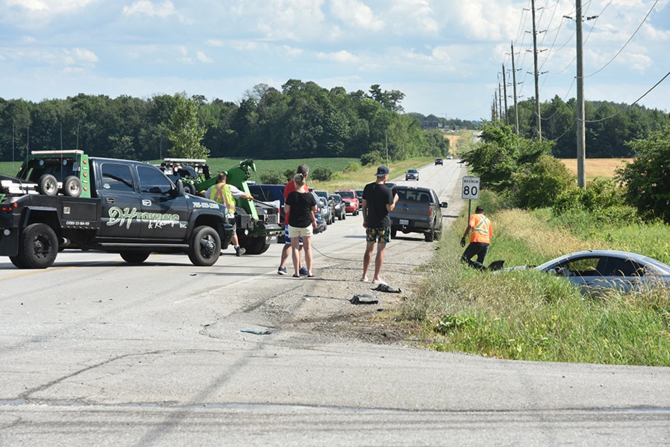 Traffic was backed up on Sideroad 20, as police prepared to clear a collision scene at Line 6 in Innisfil. Miriam King/Innisfil Today