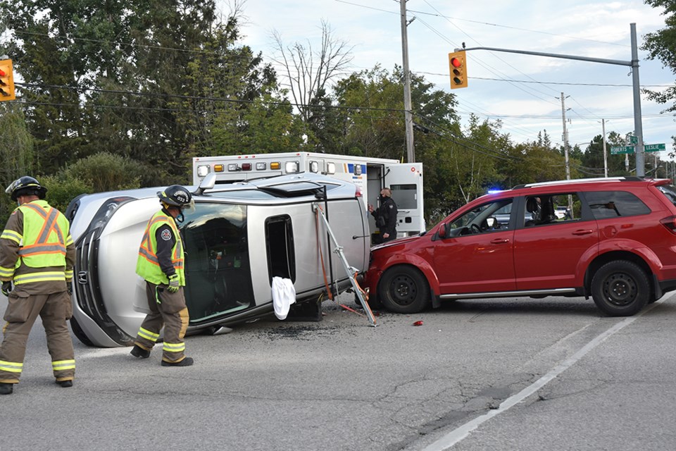 Innisfil firefighters helped extricate passengers of Honda van, which flipped on its side in Alcona, Friday evening. There were no injuries. 