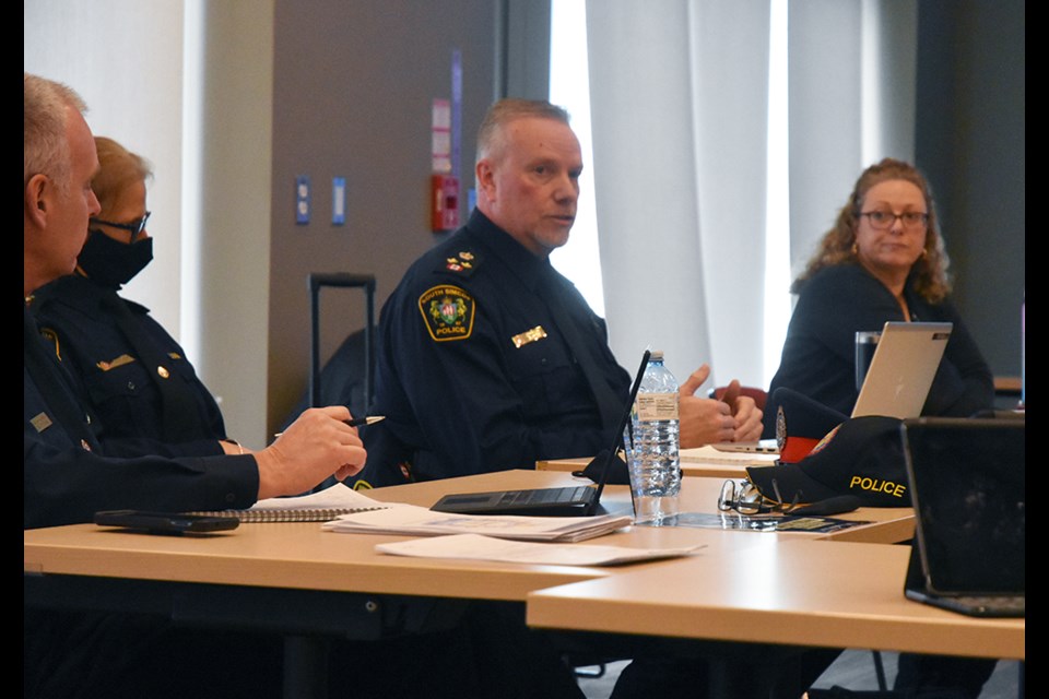 South Simcoe Deputy Police Chief John Van Dyke, centre, answers questions from the Bradford West Gwillimbury-Innisfil Police Services Board officer-worn body cameras.
