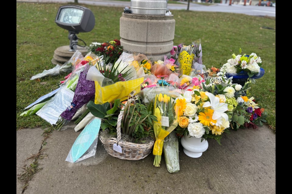 Flowers and letters have been gathered outside the South Simcoe Police north division in honour of Cst. Morgan Russell and Cst. Devon Northrup who were killed in the line of dury Tuesday in Innisfil.