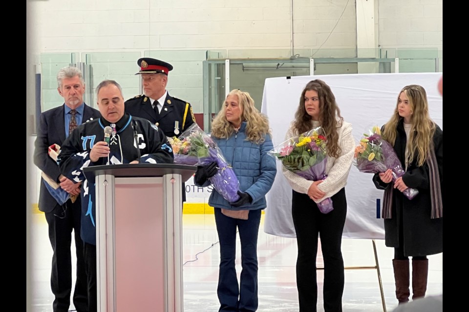 Const. Morgan Russell’s wife, Marisa, and daughters Maggie and Madelaine join local dignitaries, members of the Innisfil and Bradford town councils, South Simcoe Police Service, including Police Chief John Van Dyke, police services board chairman Chris Gariepy, and members of the Lefroy Minor Hockey Association at the renaming ceremony for the Morgan Russell Memorial Arena & Community Centre.