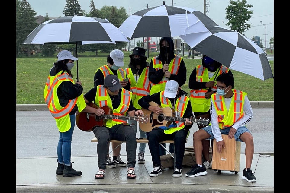 SOS (Service of Summer) Youth Team - singing (in the rain) at the Bradford Starbucks West drive thru (also collected garbage from drive thru vehicles) - free of charge!