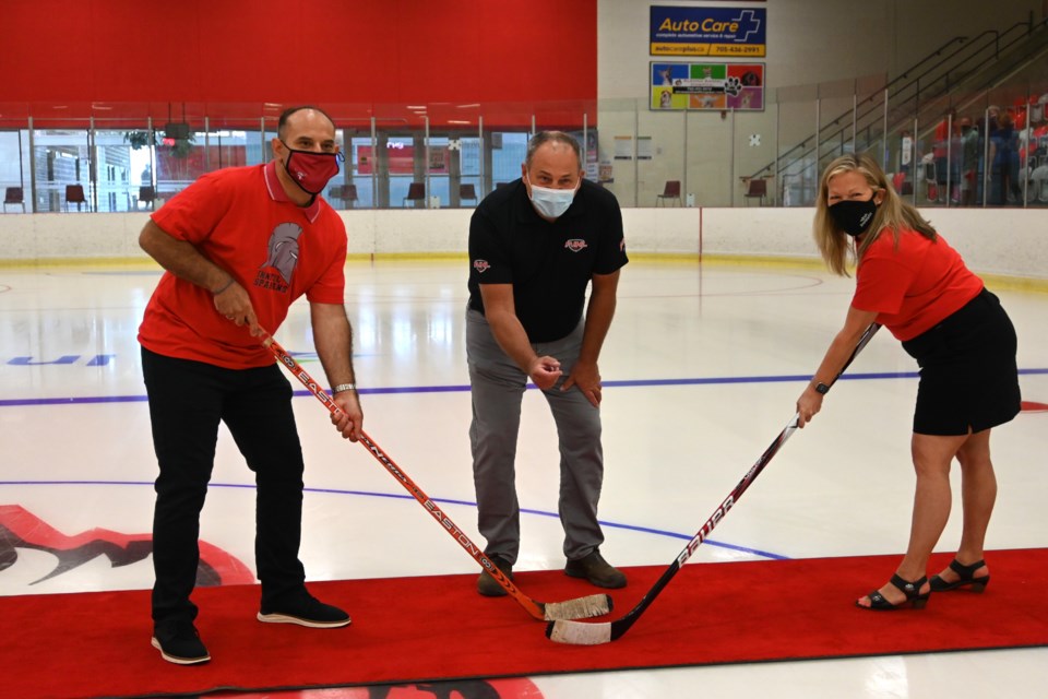 Pictured at the Innisfil Recreational Complex are, from left, George Floros, Innisfil Spartans owner and president, Terry Whiteside, Provincial Junior Hockey League commissioner, and Mayor Lynn Dollin.