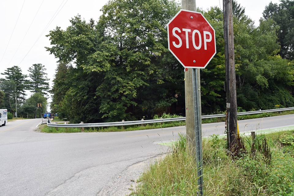 Stop signs are located on Line 7 only; through traffic on St. John's Road speeds around the curve. 
