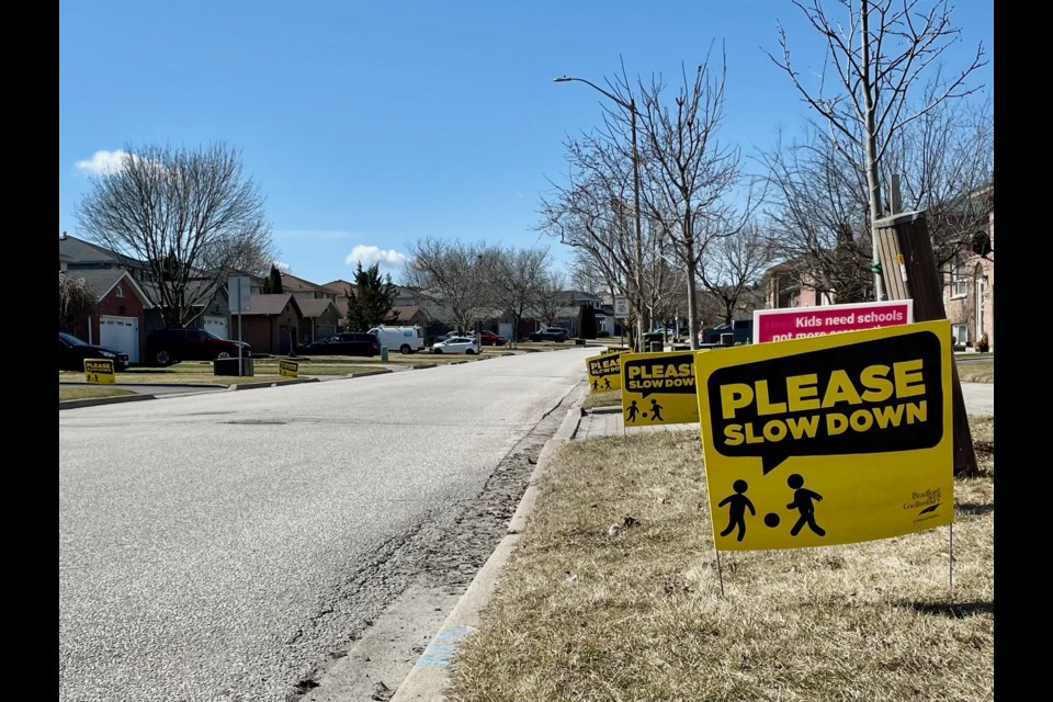 Signs reading "Please Slow Down," distributed by the Town of Bradford West Gwillimbury in 2021, have returned to Maplegrove Ave. now that the snow has melted.