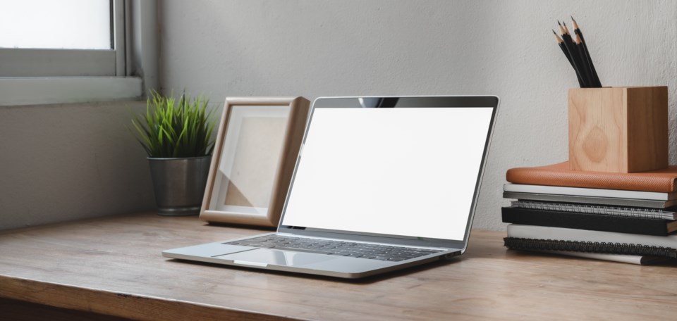 macbook-pro-on-brown-wooden-table-3787775