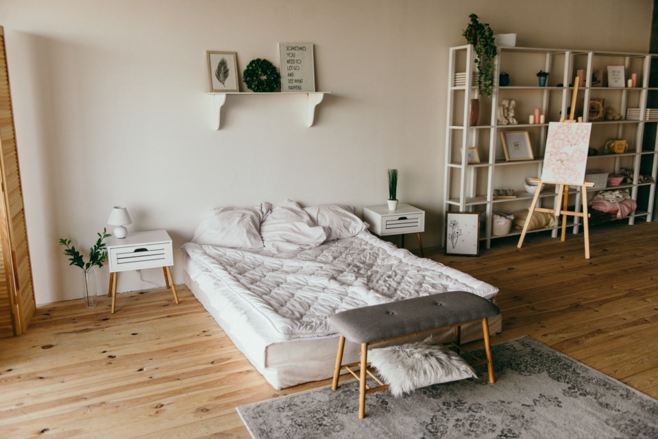 white-wooden-shelf-beside-bed-2062431