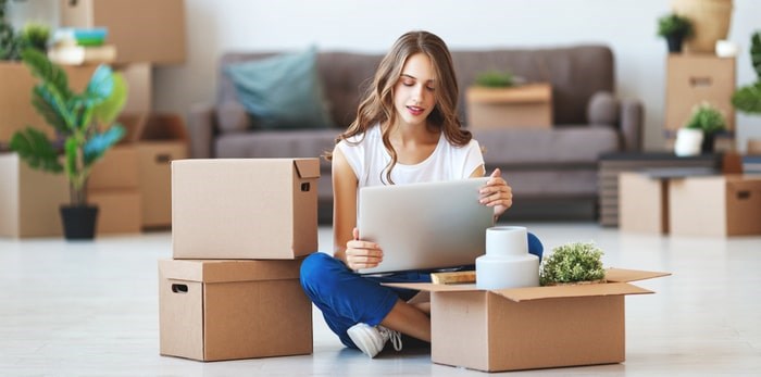 young-woman-moving-new-home-min