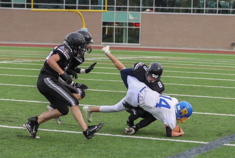 1 DB Toryn Fraser (8) for SKSS takes down Rutland QB Ty Walker_7285