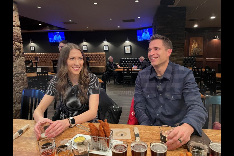 Erin Pincott (left) and John Morris have a laugh on Wednesday at the Noble Pig.