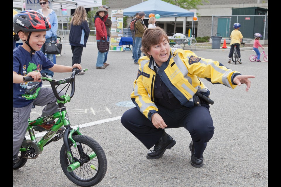 axon Tilburt, 5, gets instruction from Kamloops RCMP Auxiliary Const. Elin Edwards during the sixth annual City of Kamloops Bike Rodeo, held on the weekend at Interior Savings Centre. RCMP staff were on hand to educate kids about the rules of the road and proper hand signals and to take them through a series of stations, while the Kamloops Brain Injury Association taught kids and their parents about helmet safety and proper fit.