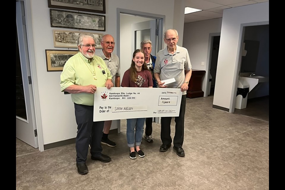 On hand to present the cheque for $2,000 is president Vaino Pennanen (left) secretary/treasurer Wayne Saboe, student recipient Sarah Nielsen, esquire Bobby Yearly and past-president Mike Wolansky.