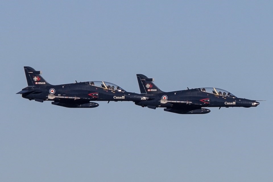 Two CT-155 Hawks of 419 Squadron fly over Kamloops during Remembrance Day ceremonies in 2014.