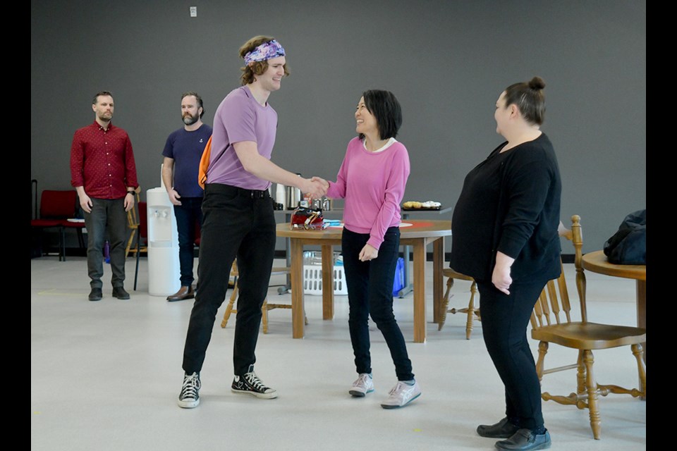 Rem Murray (as Johnny) and Yumi Ogawa (as Sandy)  rehearse a scene for Hurry Hard, a Kristen Da Silva-penned play being directed by Catriona Leger of Kamloops.