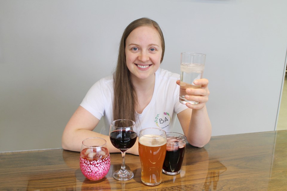 Shannon Rex of BA Brewmaster with a glass of hard seltzer, a new option for a ferment-on-premise drink.