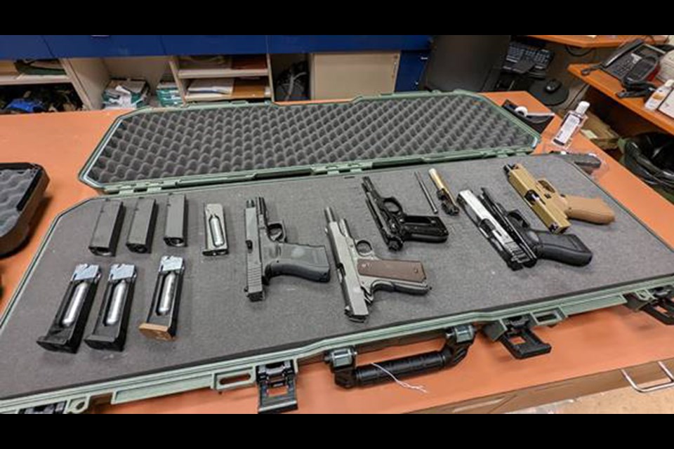 These airsoft, BB and other replica guns were seized by police during the Jan. 12, 2022, call to a motel on Columbia Street West.
