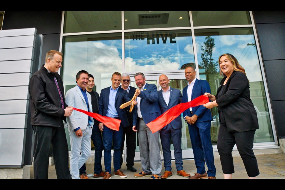Celebrating the official opening of The Hive with a ribbon-cutting on June 16 were, from left: Kamloops Central Business Improvement Association executive director Howie Reimer, A&T Project Developments president Jeff Arnold, A&T vice-president of construction Brandon Lolli, Invictus Properties Inc. president Tristan Armstrong, Armstrong Group founder Peter Armstrong, Kamloops Deputy Mayor Mike O’Reilly, Invictus Properties Inc. vice-president Bryan Pilbeam, A&T vice-president of development Gary Reed and Kamloops & District Chamber of Commerce executive director Acacia Pangilinan. The newest real estate development looks to become the premier business district of downtown Kamloops, with three office buildings eventually rising between Fifth and Sixth avenues along Lansdowne Street. The celebration was to mark the opening of the first building at the northeast corner of Lansdowne and Fifth.