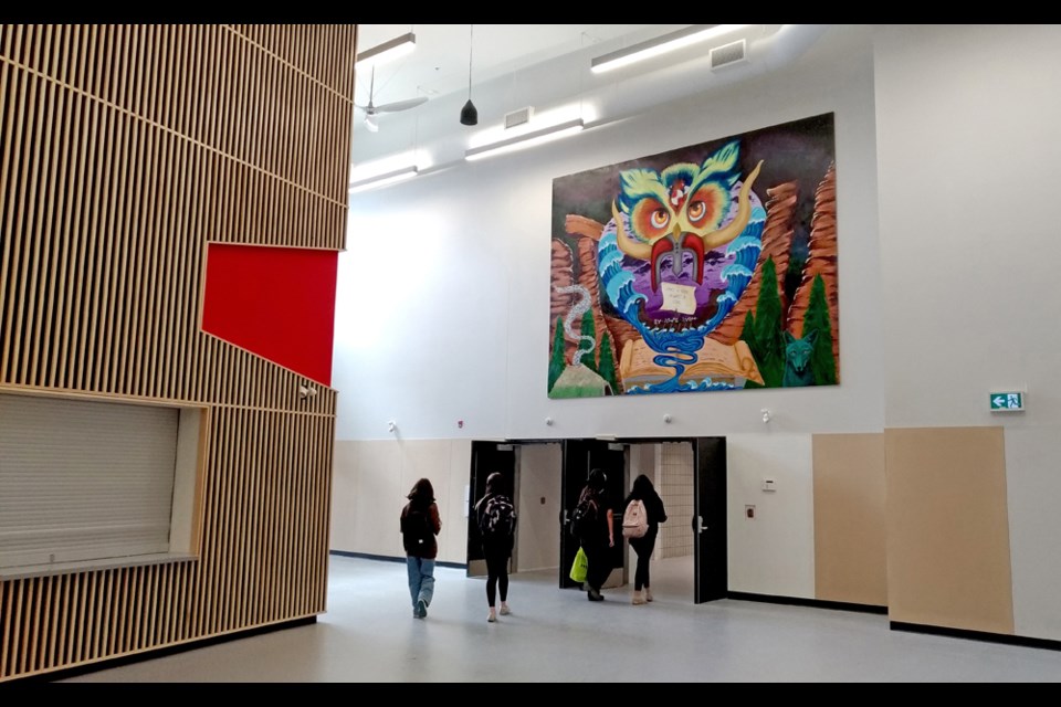 Many students had their first look at a giant art mural celebrating the school's 50th anniversary. It was co-developed by the school's senior visual arts students, art teacher Melody Tompkins and local Indigenous artist Chris Bose.