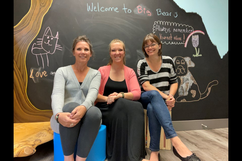 At left is Big Bear Child and Youth Advocacy Centre executive 
director Tara Ettinger. At right is Susie McCabe, a clinical counsellor at Thrive Clinical Counselling and Consulting. In the middle is Jamie Horne, whose late mother, Julie, is the namesake of the In Honour of Julie’s Journey bursary, money from which will be used by parents and caregivers of children with trauma to access their own therapy.